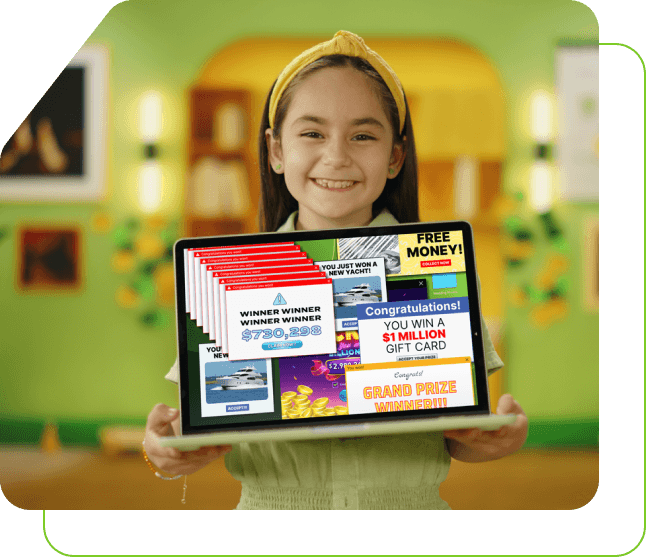 A little girl smiling while holding a laptop and the screen is facing the audience with advertisements covering the screen.