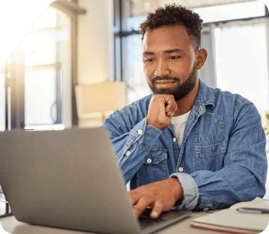 Guy looking at his laptop